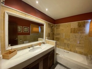 Bathtub, hair dryer, towels, soap