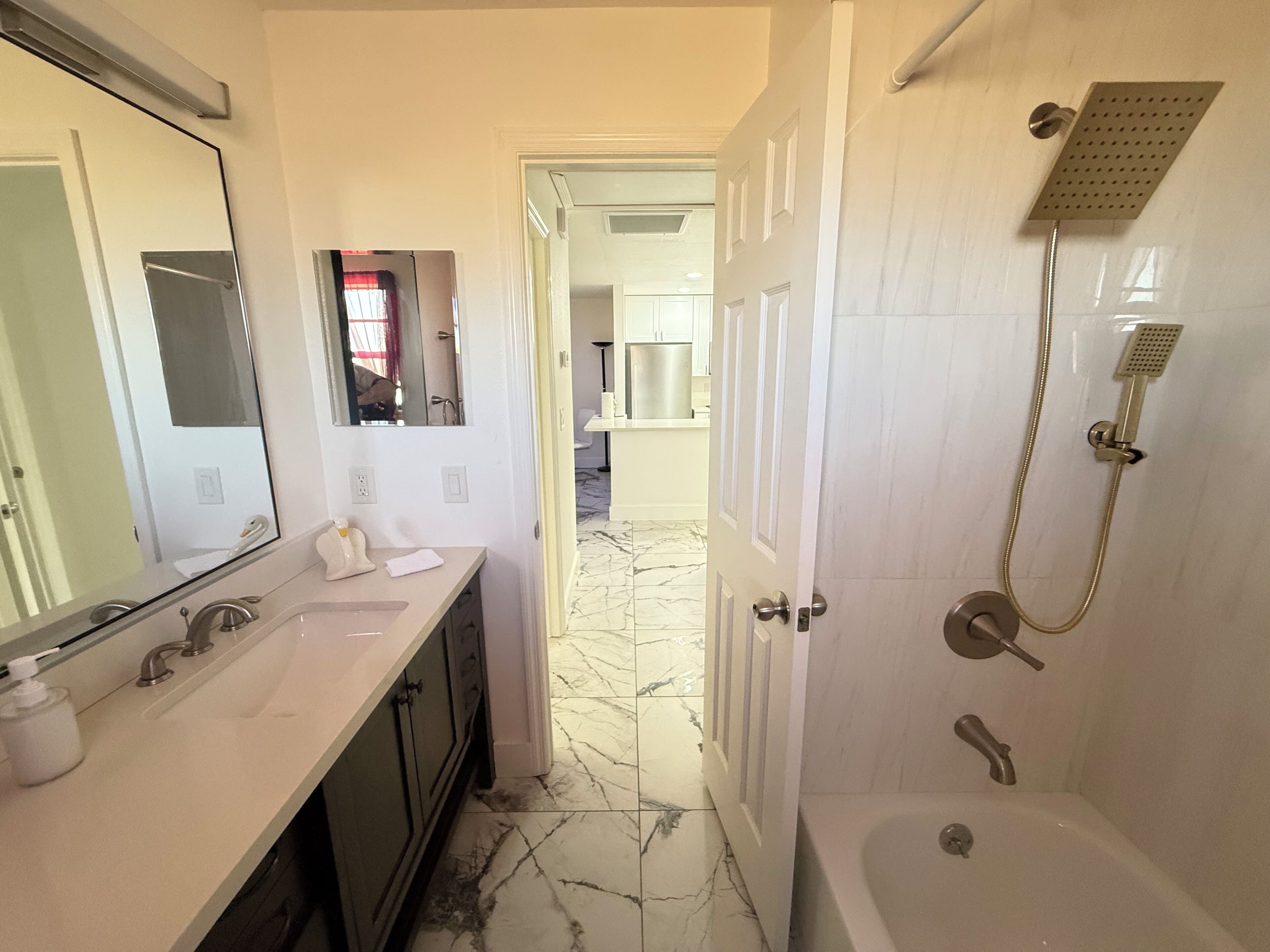 Combined shower/bathtub, hair dryer, towels, soap