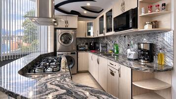 Coffee/tea maker, fridge, microwave, oven