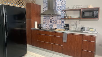 Fridge, microwave, stovetop, coffee/tea maker