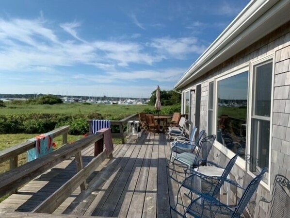 Enjoy an outdoor space with a marina view from the deck, featuring a table and chairs.