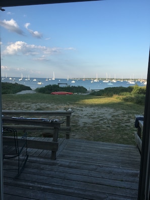 Relax on the deck with a view of the marina, perfect for a day of boating.