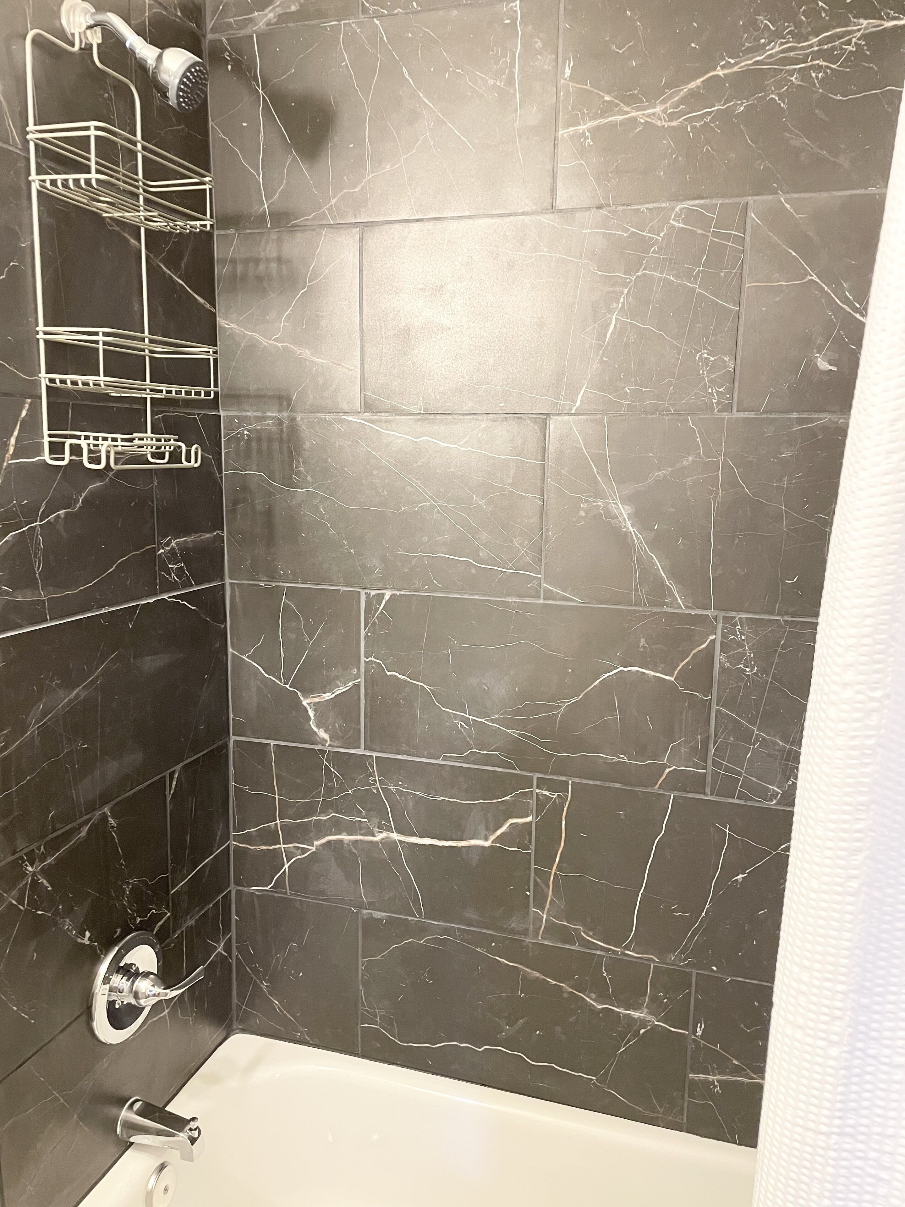 Combined shower/tub, hair dryer, towels, soap