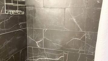 Combined shower/tub, hair dryer, towels, soap