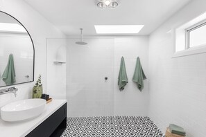 Shower, towels, soap, toilet paper