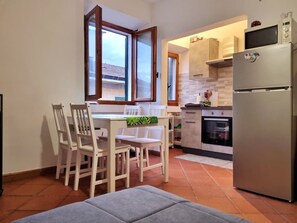 Fridge, oven, toaster, dining tables
