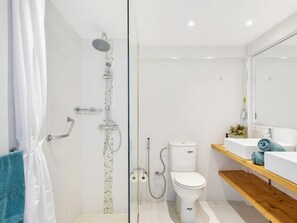 A modern bathroom with a glass shower enclosure, a white toilet, and a wooden vanity with a sink. - 76. Los Cristianos first sea line, Wi Fi (Los Cristianos)