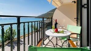 A balcony with a table set for two, overlooking a coastal view. - Holiday Apartment 'Apostolos Apartment 2' Close to Beach with Sea View (Lefkada)