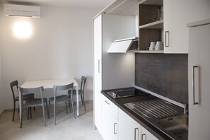 Fridge, stovetop, cookware/dishes/utensils