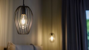 A modern room with a hanging light fixture and a visible ceiling light. - Casa De' Fiori Kefalonia★Studio 3 (Σκάλα)