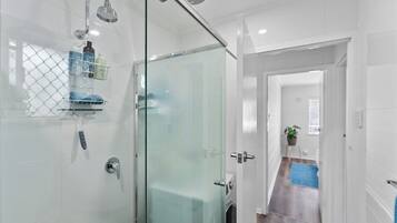 Shower, hair dryer, towels, soap