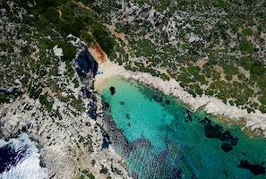 On the beach, sun-loungers, beach umbrellas, beach towels