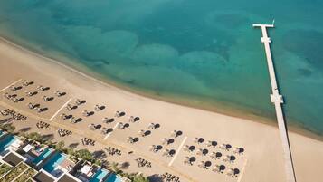 On the beach, sun loungers, beach umbrellas, beach towels