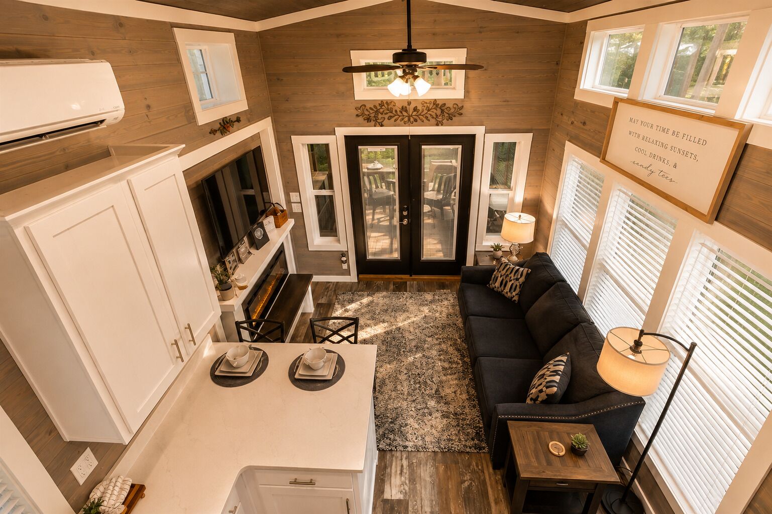 A compact living space with a kitchenette, dining area, and seating area.