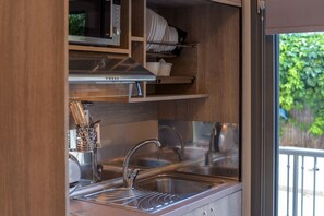 Fridge, microwave, electric kettle, cookware/dishes/utensils