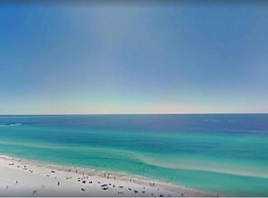 A beach with clear turquoise waters and a sandy shore. - Direct Beachfront, Wrap Balcony! Shores of Panama (Panama City Beach)