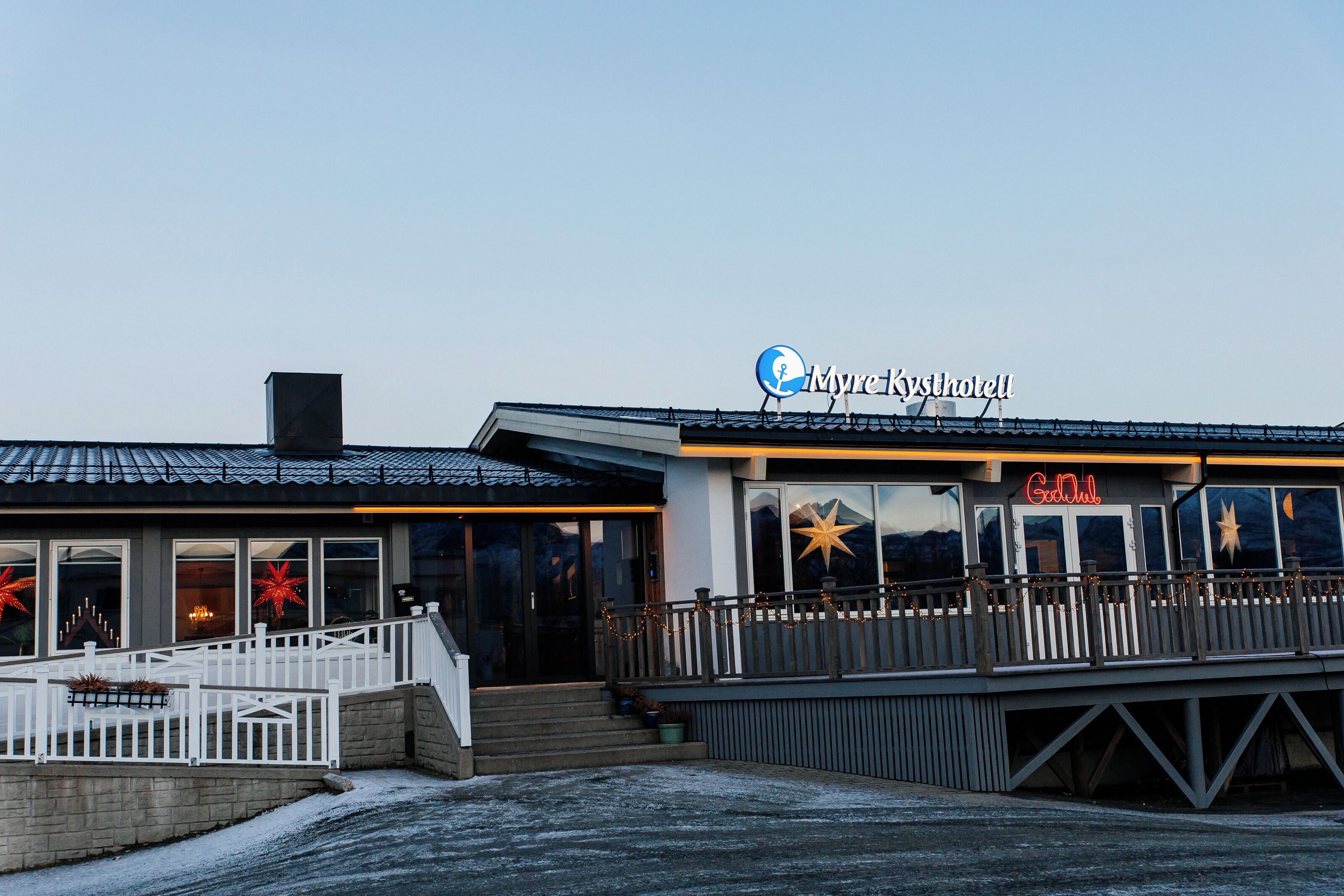 A waterfront building with a sign reading "Myre Kysthavet".