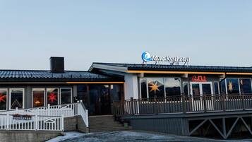 A waterfront building with a sign reading "Myre Kysthavet".