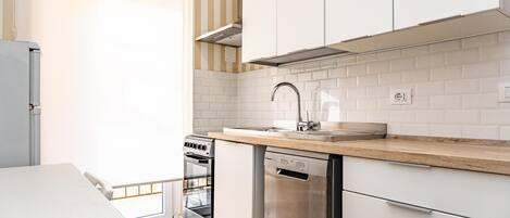 Fridge, electric kettle, toaster, cookware/dishes/utensils