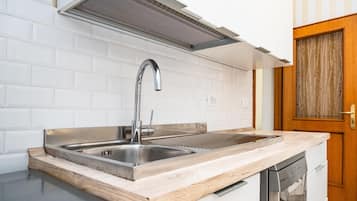 Fridge, electric kettle, toaster, cookware/dishes/utensils