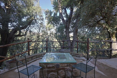House in the woods with swimming pool.