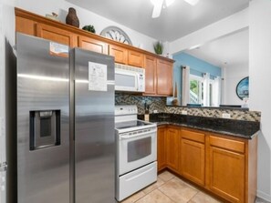 House, 5 Bedrooms | Private kitchen | Fridge, oven, coffee/tea maker - Atlantis Blue - Relaxing Beach Getaway Home Directly Across The Street From Beach Access! 5 Bedroom Home by RedAwning (Kure Beach)