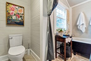Bathtub, hair dryer, towels, soap