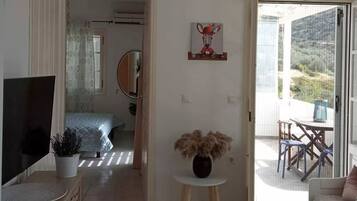 Basic Quadruple Room | Living area | 20-inch TV with digital channels