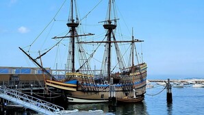A large, historic sailing ship docked at a marina with a clear blue sky in the background. - Spacious Retreat With Pool, Game Room & Fireplace | Sleeps 10 | Backyard Oasis & Screened Gazebo | Family-Friendly Getaway | 24/7 Hospitality (Plymouth)