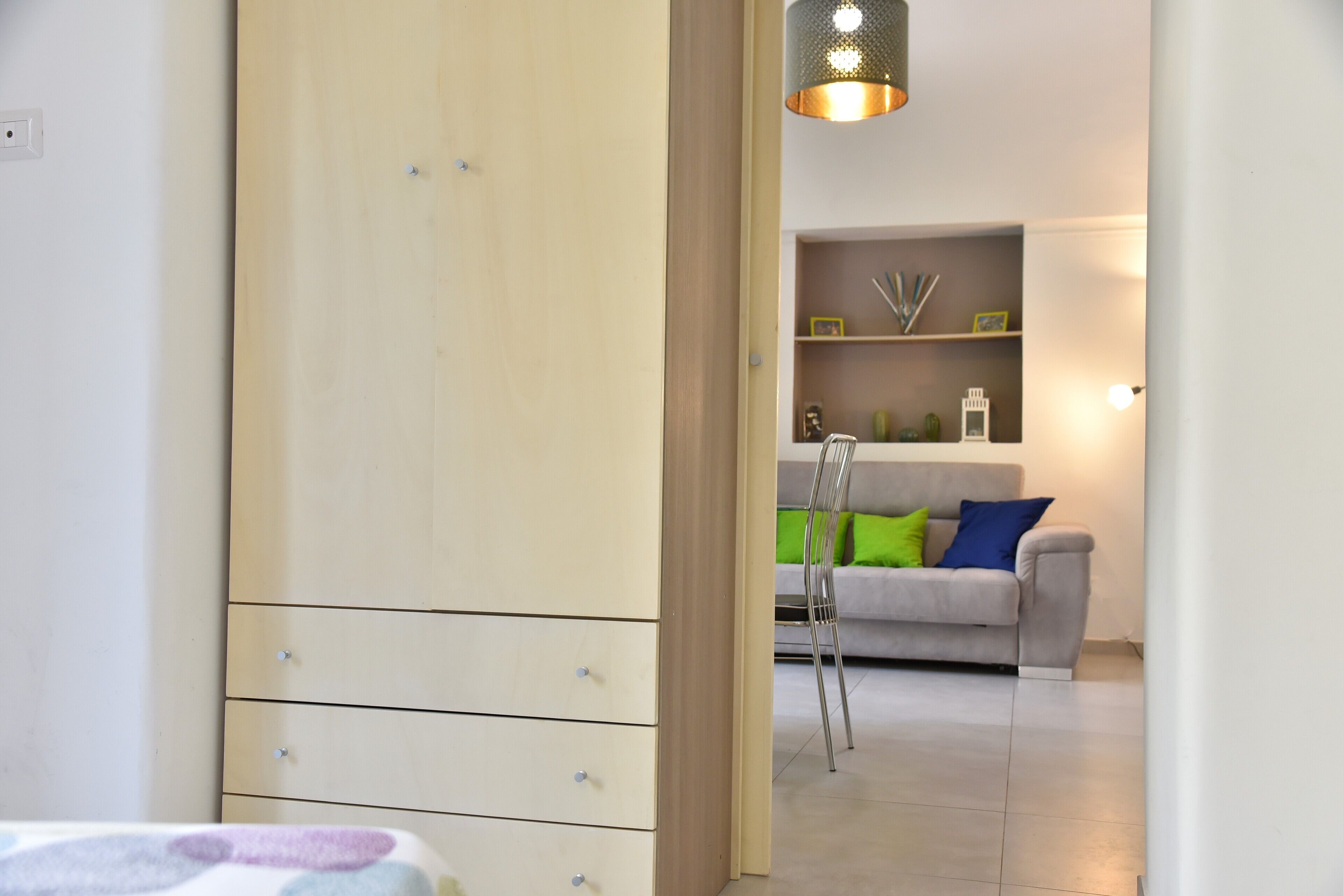 design suite, 1 bedroom, city view | living area | flat-screen tv