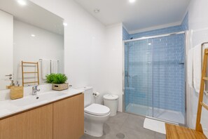 Shower, hair dryer, towels, soap