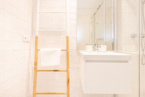 Shower, hair dryer, towels, soap