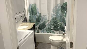 Combined shower/bathtub, hair dryer, towels, soap