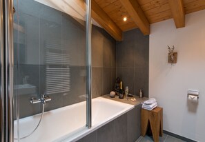 Bathtub, hair dryer, towels