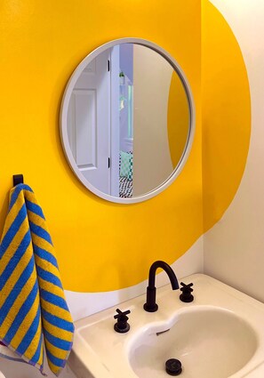 Combined shower/bathtub, hair dryer, towels, toilet paper