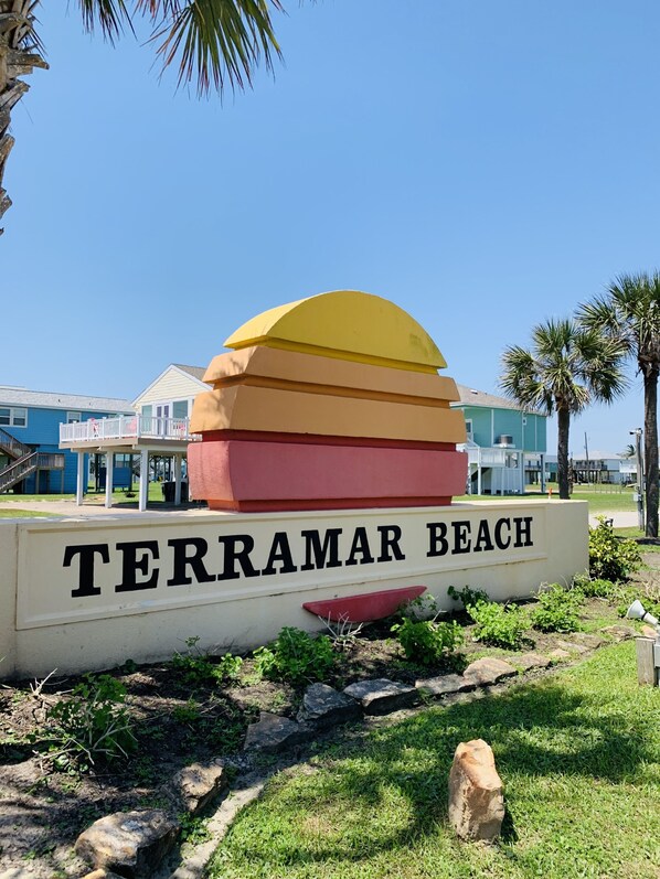 A sign for Terramar Beach with a layered design and the name 'Terramar Beach' in bold letters. - Happy House, minutes to the Beach! (Galveston)