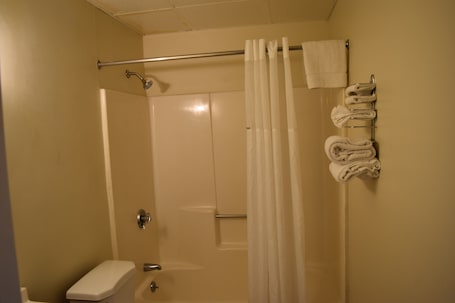 Combined shower/tub, rainfall showerhead, towels, soap. PLYMOUTH MOTOR LODGE