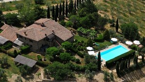 An aerial view of a property with a large house, a swimming pool, and surrounding greenery. - LAURO apartment kitchen, garden (Toscana)