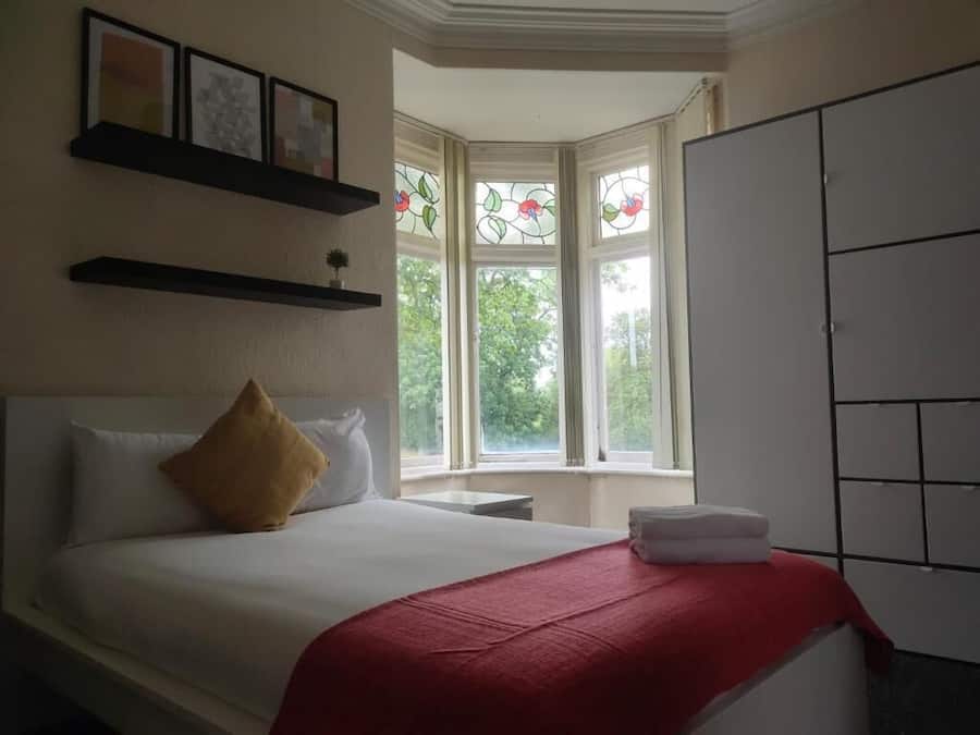 Premium bedding, desk, laptop workspace, soundproofing