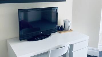 Premium bedding, desk, laptop workspace, soundproofing