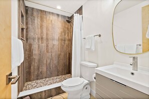 Shower, hair dryer, towels, shampoo