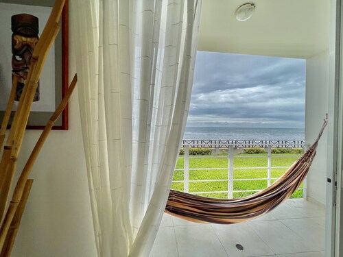 Bright and calm beachfront condo