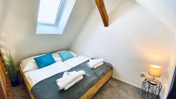 1 bedroom, desk, iron/ironing board, travel crib