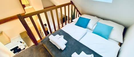 1 bedroom, desk, iron/ironing board, travel crib