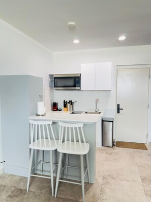 Fridge, microwave, stovetop, coffee/tea maker