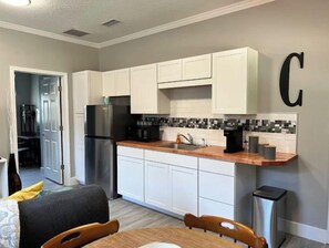 Fridge, microwave, stovetop, coffee/tea maker