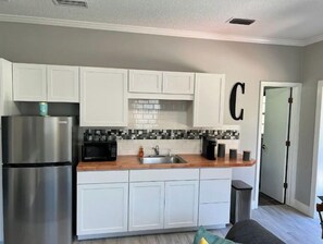 Fridge, microwave, stovetop, coffee/tea maker