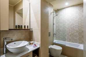 A bathroom with a large vessel sink, a toilet, and a shower area. - Sunset Villa - Panorama Sea View Villa (Platanias)