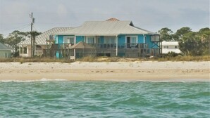 A two-story house with a metal roof, located on a sandy beach with ocean views. - BEACHFRONT
Gorgeous View!!!
OCEANFRONT
Sunday to Sunday (Eastpoint)
