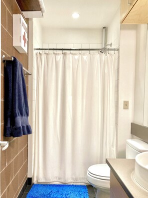 Bathtub, hair dryer, towels, soap